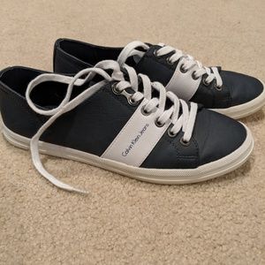 Size 7.5. Calvin Klein tennis shoe.  Navy & white